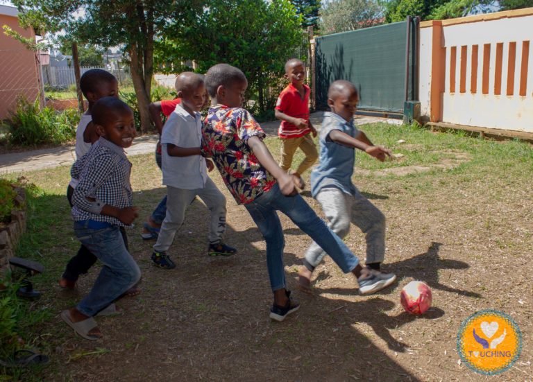 TA boys playing soccer at their new home